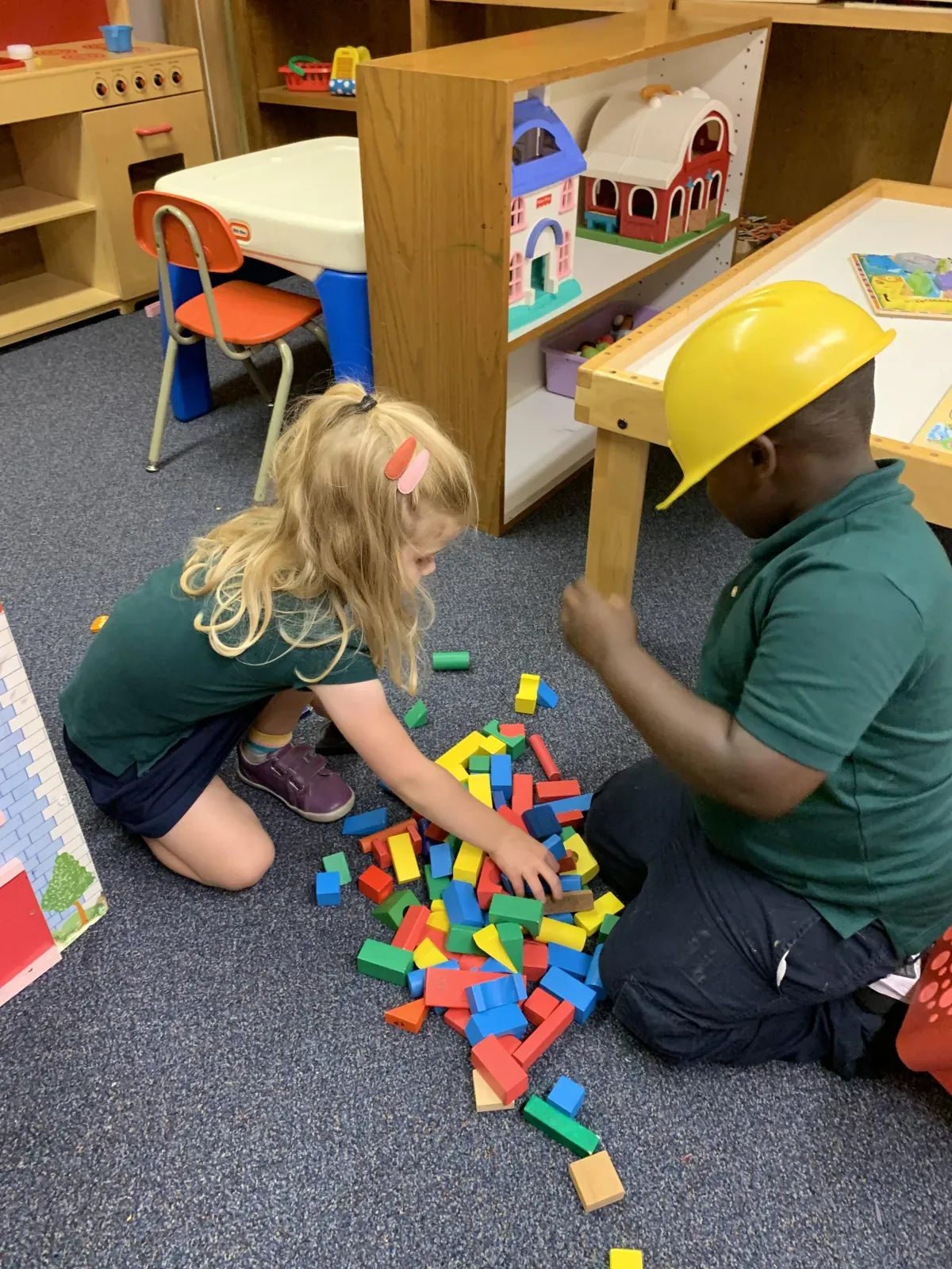 Preschoolers busy at classroom learning centers