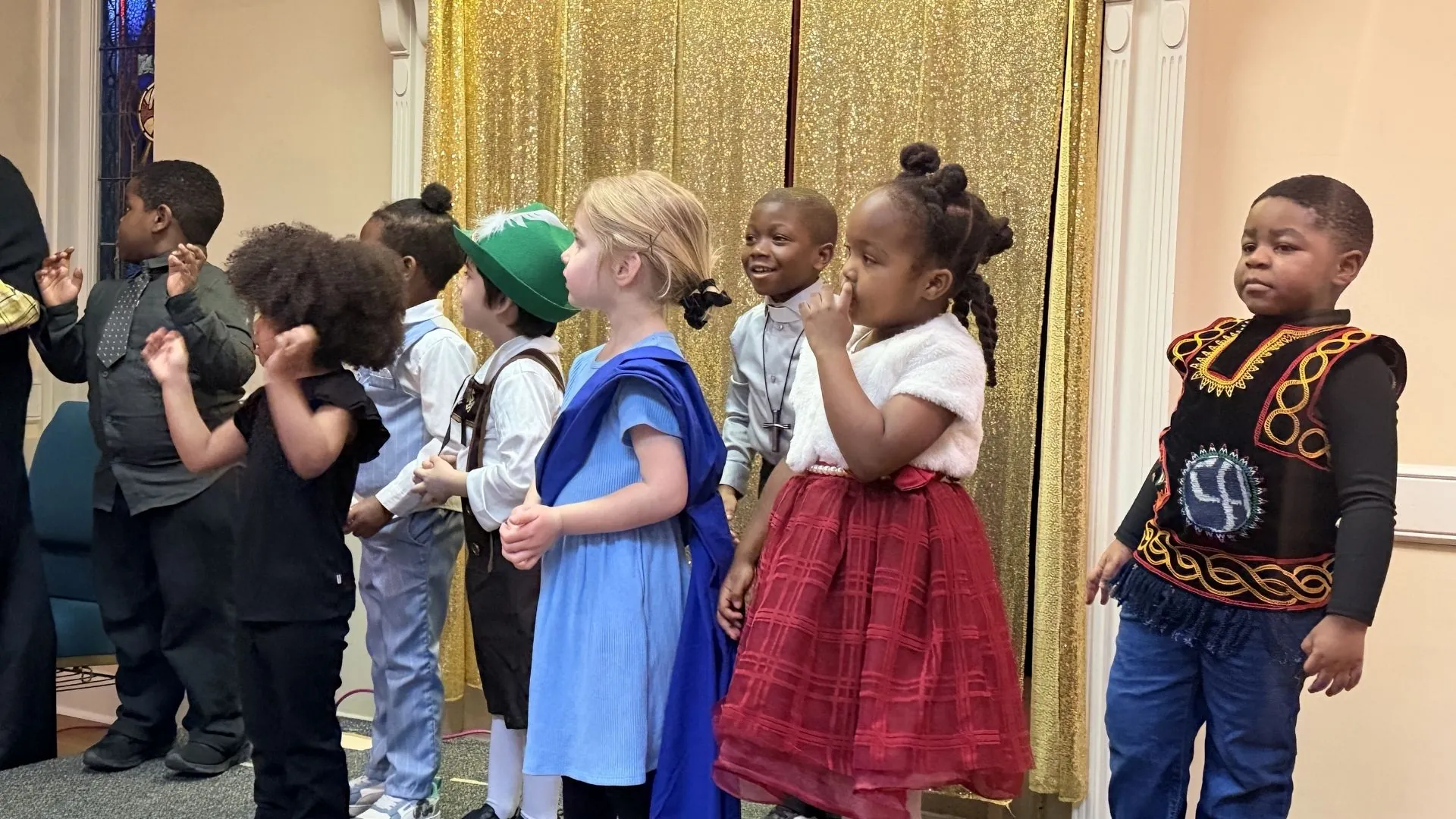 Seeds of Wisdom preschoolers in cultural dress performing together at a school celebration
